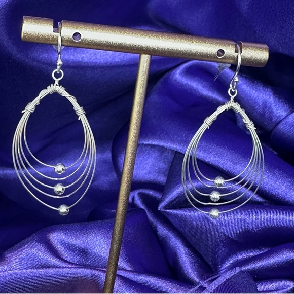 Multi Hoops with moving silver balls dangle earrings. - Picture 10 of 12